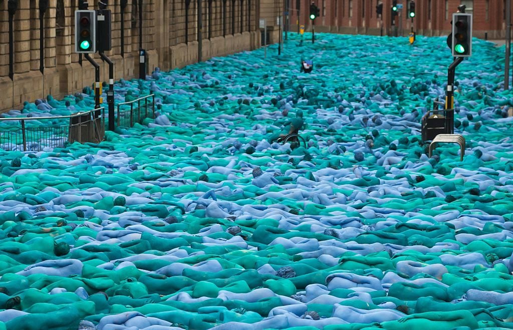 Naked volunteers, painted in blue to reflect the colours found in Marine paintings in Hull's Ferens Art Gallery. Photo by Jon Super/AFP courtesy of Getty Images.