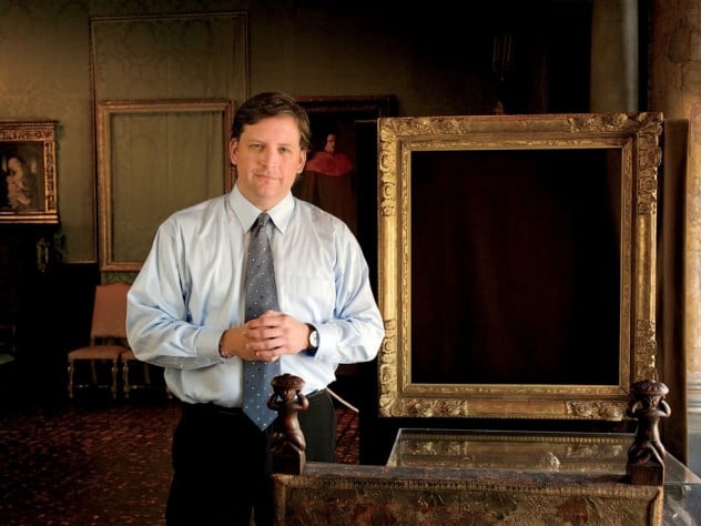 Anthony Amore at the Isabella Stewart Gardner Museum in Boston, with empty frames left behind after the museum's infamous 1990 theft. Courtesy of the Isabella Stewart Gardner Museum