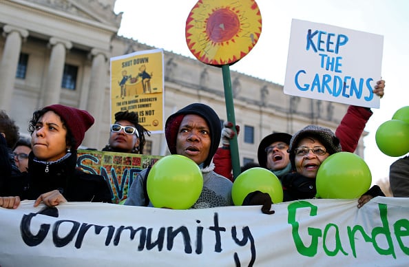Protesters of the Brooklyn Anti-Gentrification Network hold protest signs outside Brooklyn Museum, the venue of the Brooklyn Real Estate Summit, in New York, U.S., on Tuesday, Nov. 17, 2015. Photographer: Yana Paskova/Bloomberg via Getty Images