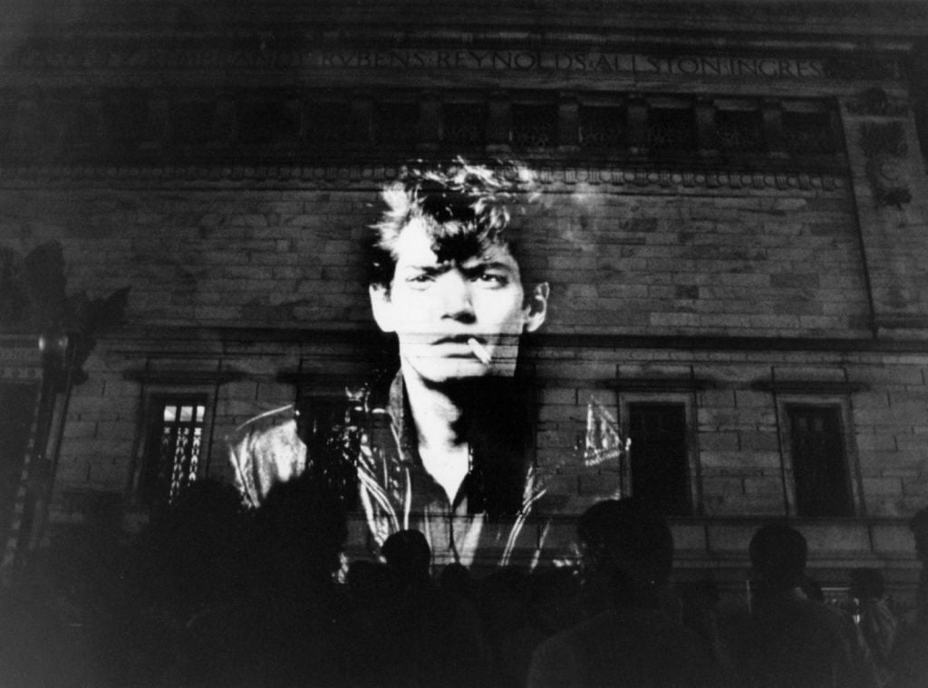 Projection of a Mapplethorpe self-portrait during the protest at the Corcoran Gallery on June 30, 1989. Courtesy Carol Guzy/The Washington Post.