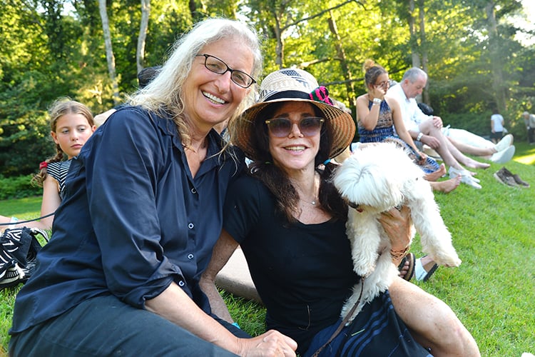 Annie Leibovitz, Jane Rose, and the camera shy Ruby Tuesday at the LongHouse Reserve's presentation of Laurie Anderson's Concert for Dogs. © Patrick McMullan.
