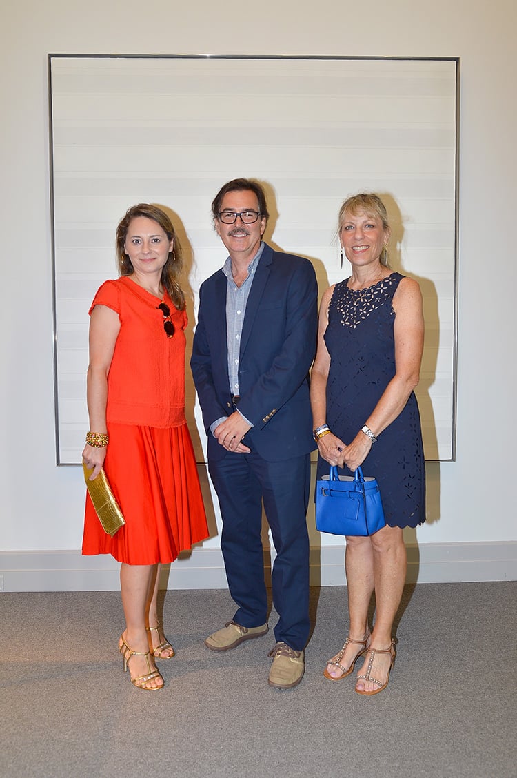 Susan Vecsey, Eric Dever, and Arin Goldman at the Guild Hall Summer Gala. © Patrick McMullan.