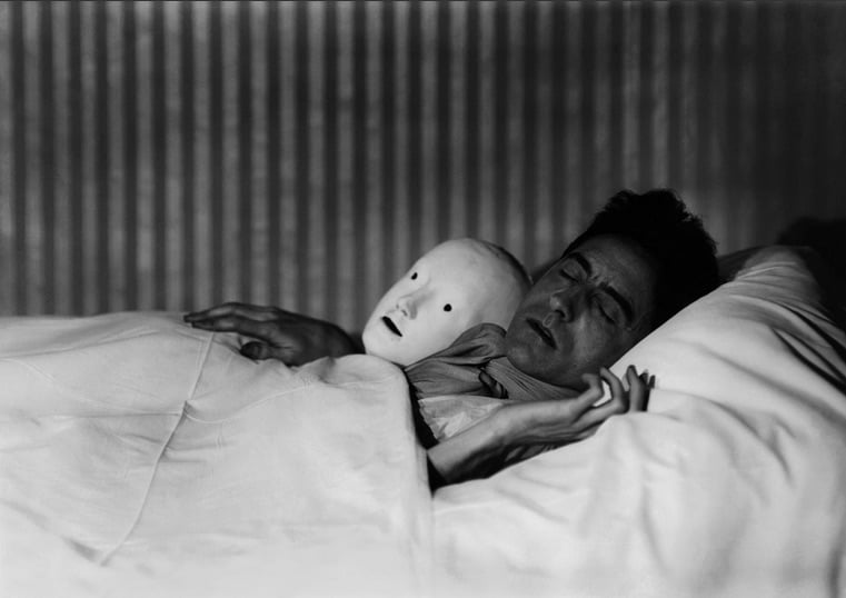 Berenice Abbott, Cocteau in Bed with a Mask, Paris(1927). Courtesy Cheim & Read
