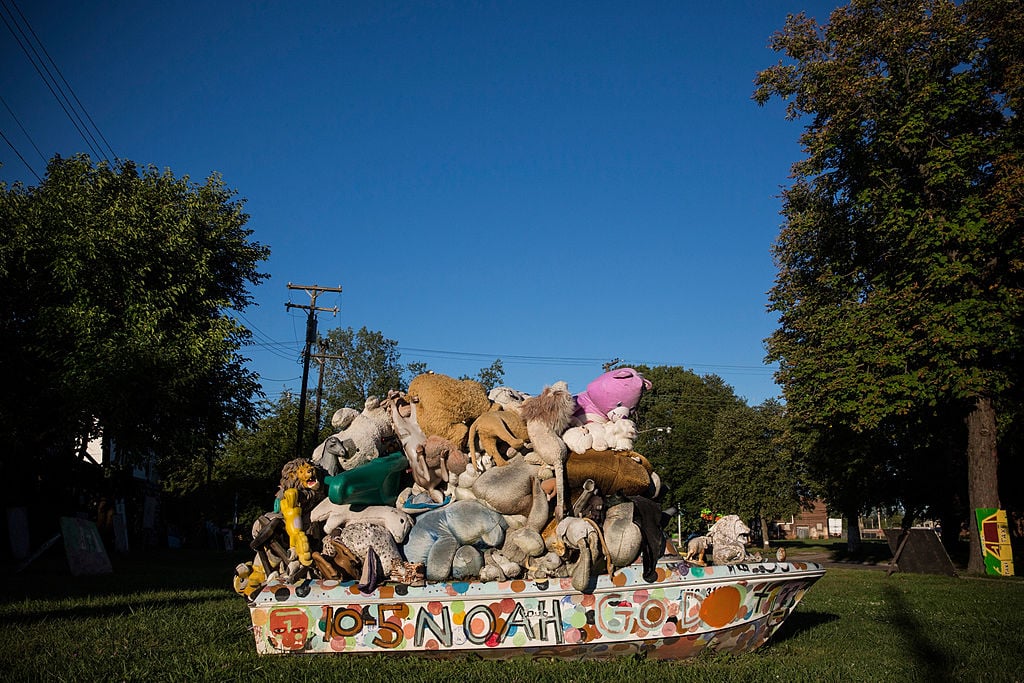 A sculpture created from recycled material sits amongst the "Heidelberg project," which is an "open air art environment" centered around one block in Detroit, on September 3, 2013 in Detroit, Michigan. The Heidelberg project is the brain child of Tyree Guyton. He and other artists use the urban environment (including homes and sidewalks) as a canvas for art, which they make using paint and recycled materials. Courtesy of Andrew Burton/Getty Images.