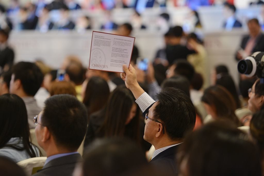 Bidding during Christie's first sale in Shanghai in 2013. Courtesy Peter Parks/AFP/Getty Images.