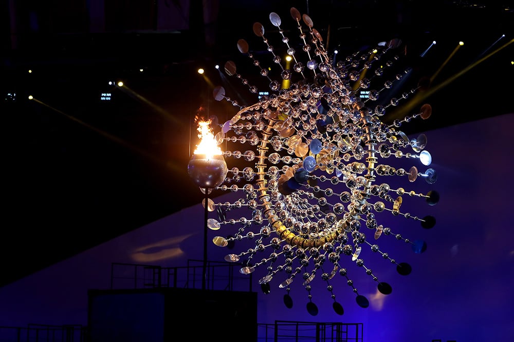 The Olympic Cauldron is lit alongside a sculpture by Anthony Howe at the Rio 2016 Olympic Games at Maracana Stadium. Courtesy of Christian Petersen/Getty Images.
