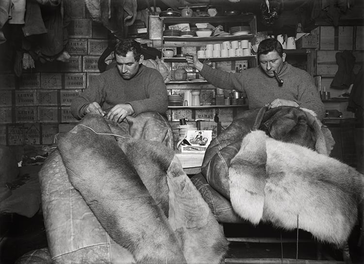 Herbert George Ponting, Petty officer Evans and Crean mending sleeping bags. Courtesy of Bonhams.