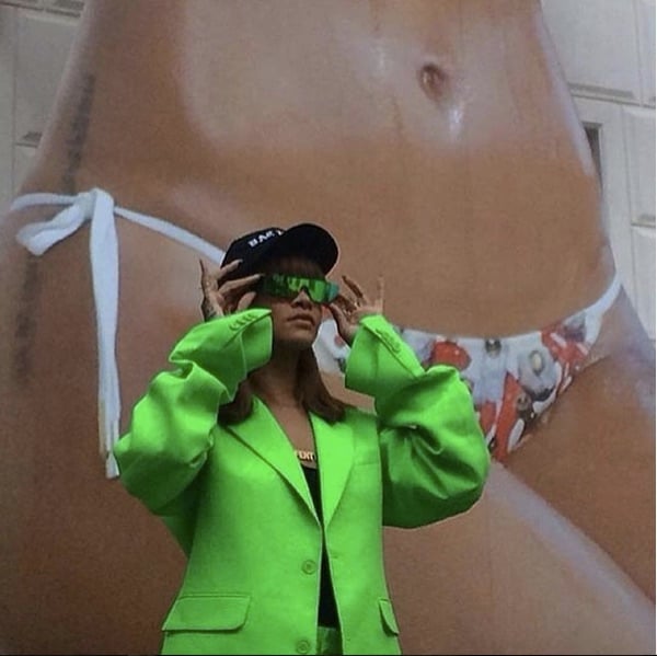 Rihanna poses with her likeness. Photo courtesy Rudeboyyfenty's Instagram.