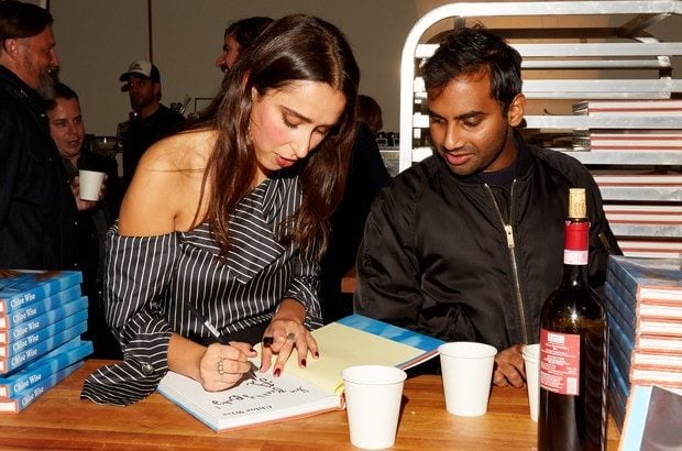 Chloe Wise signs her new book for Aziz Ansari. Courtesy of Jimmy Tagliaferri.