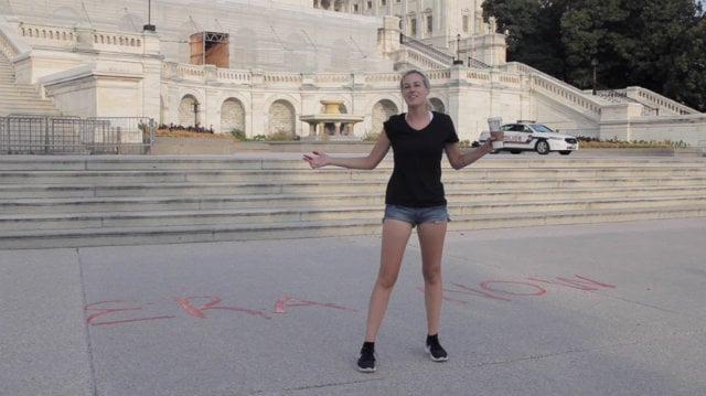 Natalie White after writing "ERA NOW" on the pavement in front of the US Capitol. Courtesy of Sheila Maria Lobo, from the upcoming documentary NSFW: Not Suitable for Women.