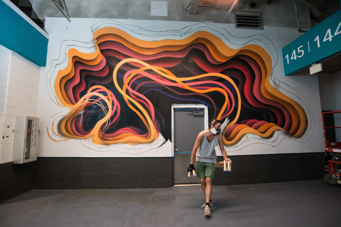 1010 creates a mural at the Miami Dolphin's Hard Rock Stadium. Courtesy of Martha Cooper/Goldman Global Arts.
