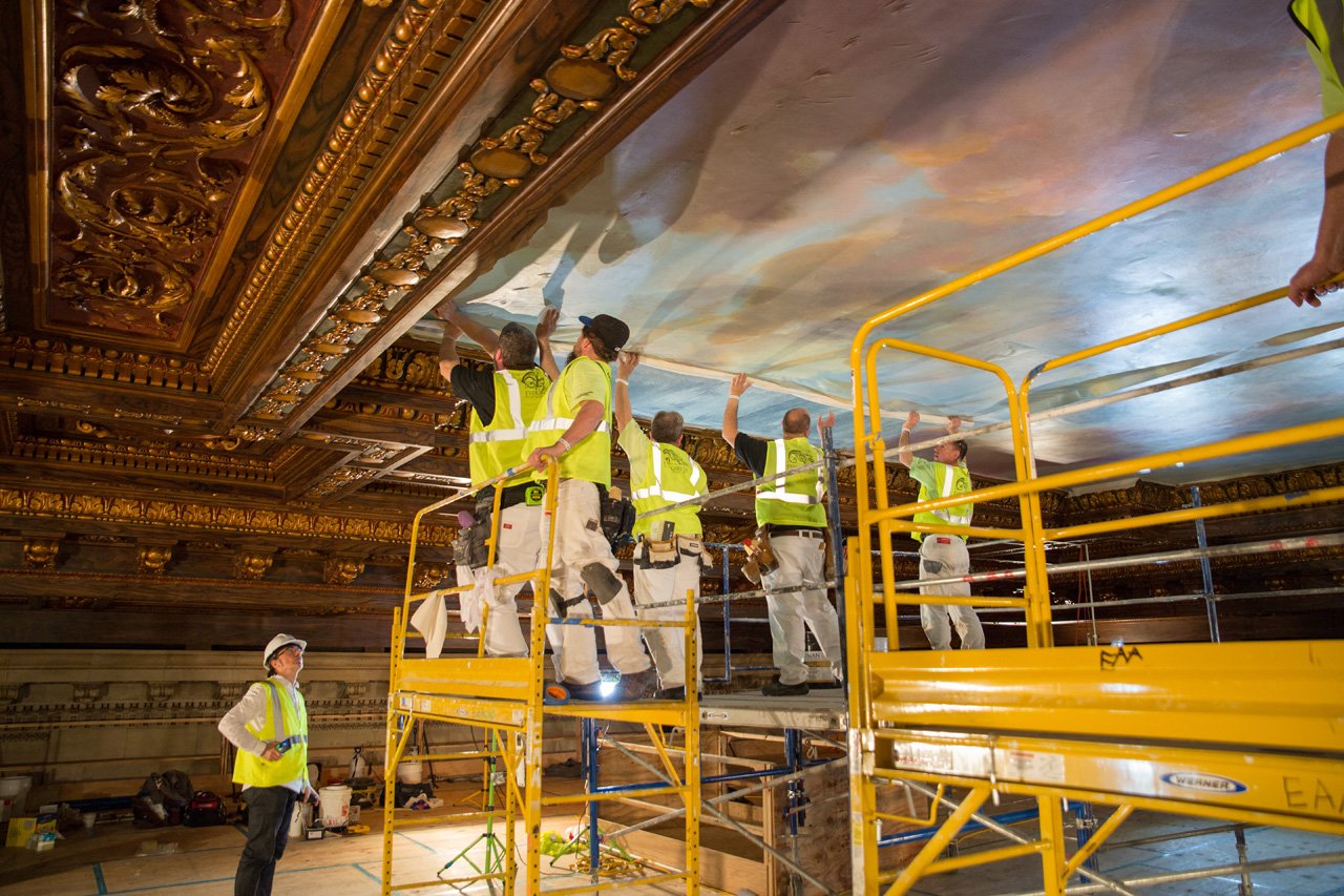 Workers restoring the ceiling at the Rose Main Reading Room at the New York Public Library. Courtesy of the New York Public Library. 