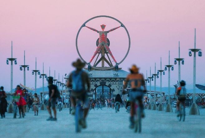 The #BurningMan effigy stands above the playa at sunset. Courtesy of Chase Stevens via Instagram.