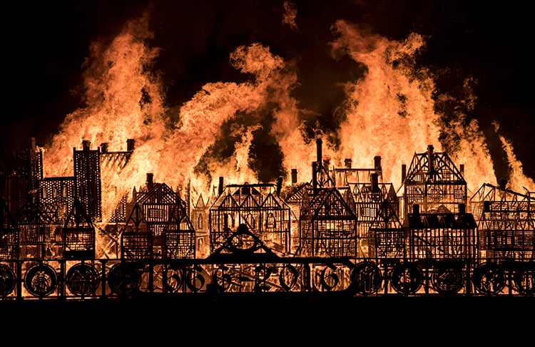 A wooden model of London's 17th-century skyline burns on the River Thames after it was set alight in a dramatic retelling of the story of the Great Fire of London on September 4, 2016 in London, England. The event commemorated the 350th anniversary of the Great Fire of London. Courtesy of John Phillips/Getty Images.