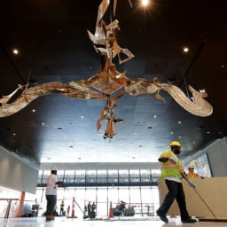 Workers finish sweeping the entry area of the Smithsonian's National Museum of African American History and Culture during the press preview on the National Mall September 14, 2016 in Washington, DC. Courtesy of Getty Images.