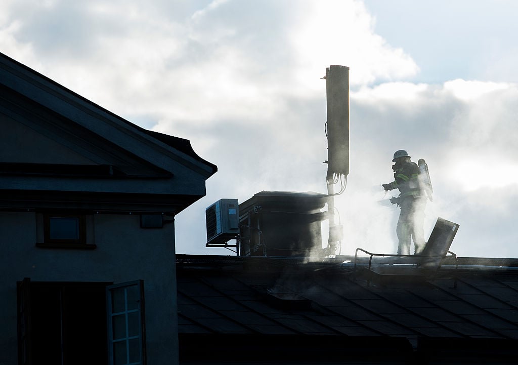 Firemen work on putting out a fire at the Royal Institute of Art located next to the Moderna Museet, the Museum of Modern Art, on September 21, 2016 in Stockholm. Courtesy of Jonathan Nackstrand/AFP/Getty Images.