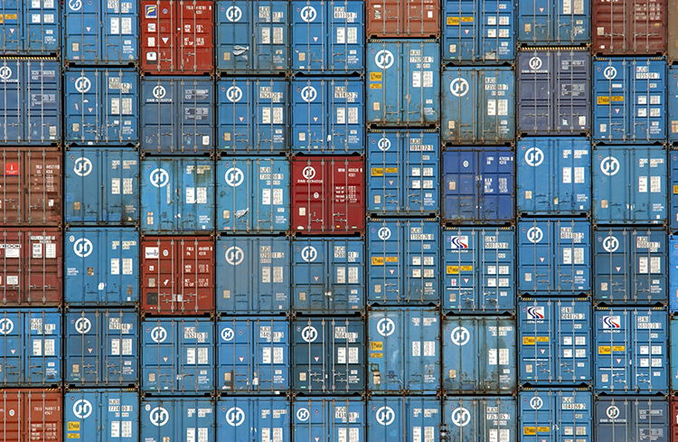 403123 07: Thousands of truck-sized 30-ton shipping containers are stacked aboard the Hanjin Oslo freighter in the Port of Los Angeles March 29, 2002. Courtesy of David McNew/Getty Images.