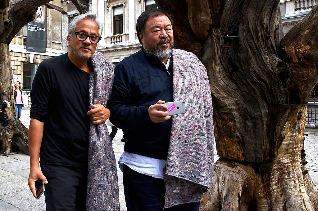 Anish Kapoor and Ai Weiwei depart the Royal Academy as they walk through the city as part of a march in solidarity with migrants currently crossing Europe on September 17, 2015 in London. Photo Ben Pruchnie/Getty Images.