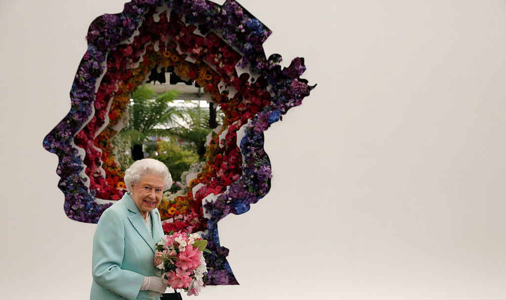 Queen Elizabeth II next to a floral exhibit at the Chelsea Flower Show press day at Royal Hospital Chelsea on May 23, 2016 in London. Photo Adrian Dennis/WP Pool/Getty Images.