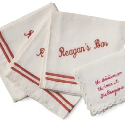 Ronald and Nancy Reagan's custom bar napkins, reading"the drinks are on the house at The Reasans," carried a $400 top estimate, and sold for $7,500. Courtesy of Christie's.