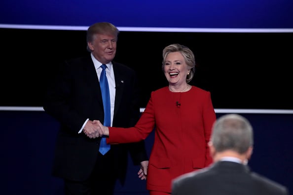 Republican presidential nominee Donald Trump and Democratic presidential nominee Hillary Clinton shake hands after the Presidential Debate at Hofstra University. Photo by Drew Angerer/Getty Images.