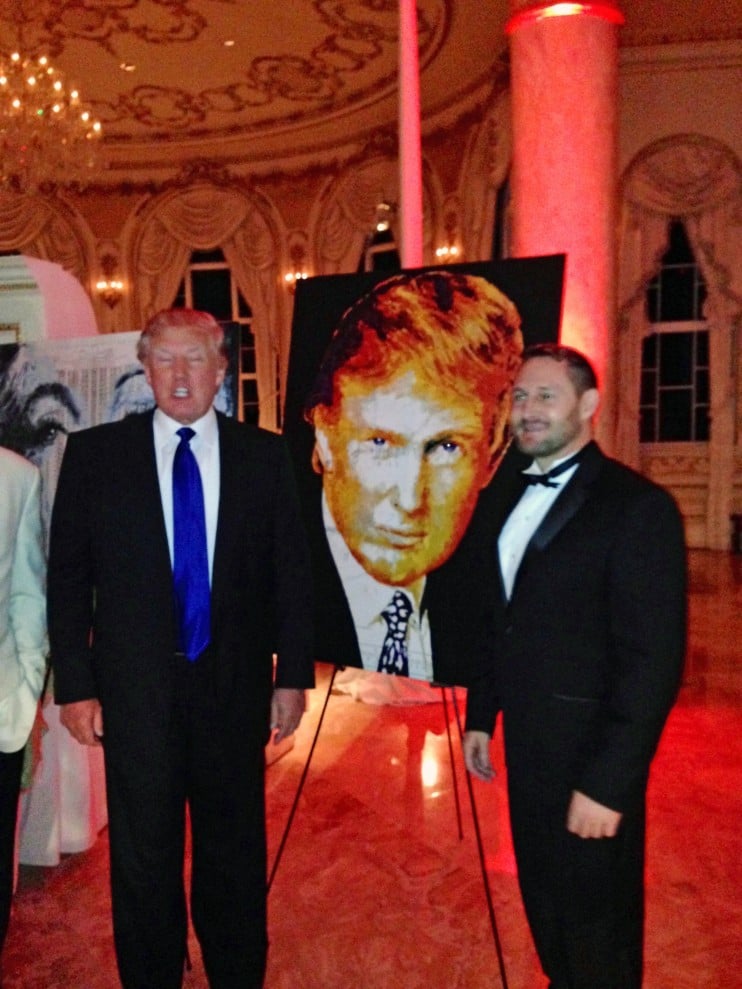 Havi Shanz and Donald Trump with his portrait <em>Donald Trump</em> at a 2014 charity auction. Courtesy of Havi Shanz/@HaviArt.