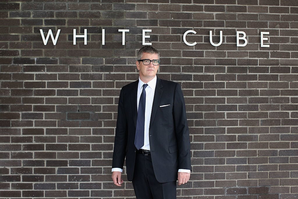 LONDON, ENGLAND - OCTOBER 11: Jay Jopling, owner of the White Cube galleries, poses outside the new White Cube gallery in Bermondsey on October 11, 2011 in London, England. The third White Cube gallery, which will officially open to the public tomorrow, is the biggest commercial gallery in Europe with 5440 square metres of interior space. It is currently showcasing the exhibition 'Structure & Absence' which features works by Damien Hirst and Andreas Gursky. (Photo by Oli Scarff/Getty Images)
