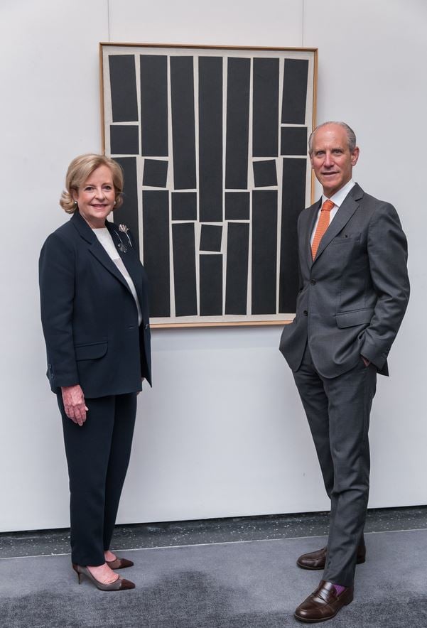 Patricia Phelps de Cisneros and MoMA director Glenn D. Lowry, in front of Hélio Oiticica's Painting 9. (1959). Courtesy of the Museum of Modern Art.