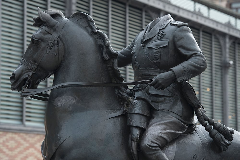 A picture taken on October 17, 2016 shows the sculpture of Spanish late dictator Francisco Franco on a horse during its installation for a temporary exhibition titled 
