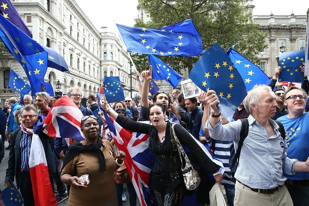 Demonstrators on an anti-Brexit March for Europe hold EU flags as they march to Parliament Square in central London. Photo JUSTIN TALLIS/AFP/Getty Images.