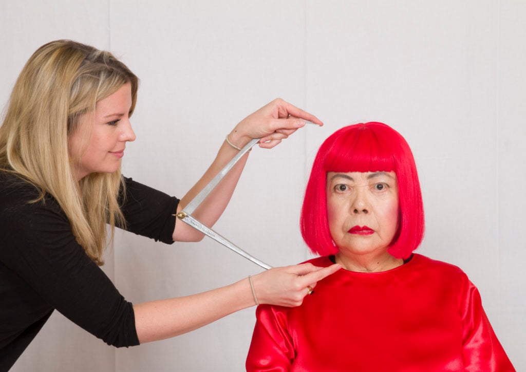 The production team at Madame Tussauds takes measurements of artist Yayoi Kusama. Courtesy Madame Tussauds Hong Kong.