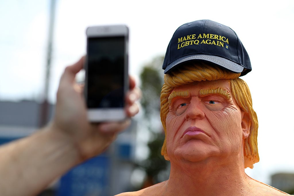 A passerby takes a picture of a statue depicting Republican presidential nominee Donald Trump in the nude on August 18, 2016 in San Francisco. Photo Justin Sullivan/Getty Images.