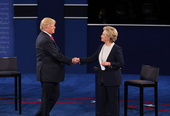 Donald Trump, 2016 Republican presidential nominee, shakes hands with Hillary Clinton, 2016 Democratic presidential nominee. Photographer: Daniel Acker/Bloomberg via Getty Images