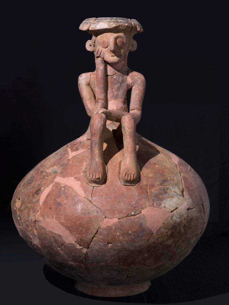 A 3,800-year-old jug found in Israel is being described as a Bronze Age <em>The Thinker</em>. Photo courtesy of the Israel Antiquities Authority/Clara Amit European Pressphoto Agency.