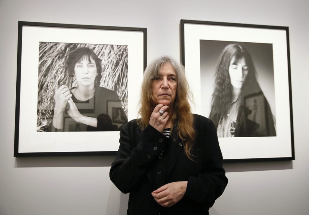 US singer and songwriter Patti Smith poses during the opening of an exhibition dedicated to the late US photographer Robert Mapplethorpe at the Grand Palais in Paris on March 24, 2014. Courtesy of PATRICK KOVARIK/AFP/Getty Images.