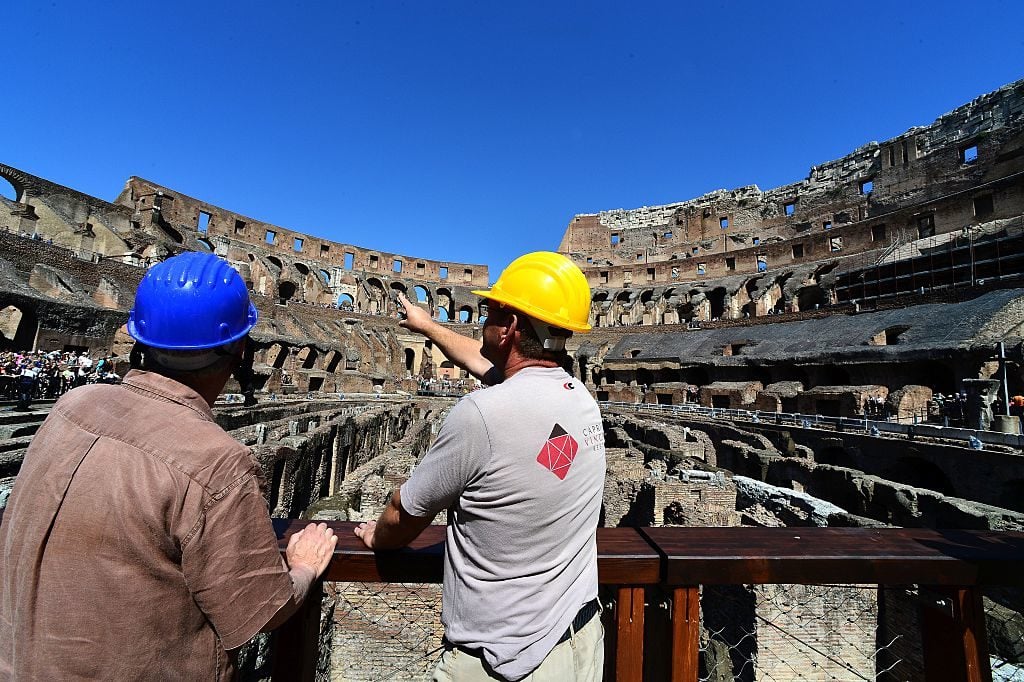 Workers in the Colosseum on June 28, 2016 in Rome. Photo courtesy Alberto Pizzoli/AFP/Getty Images.