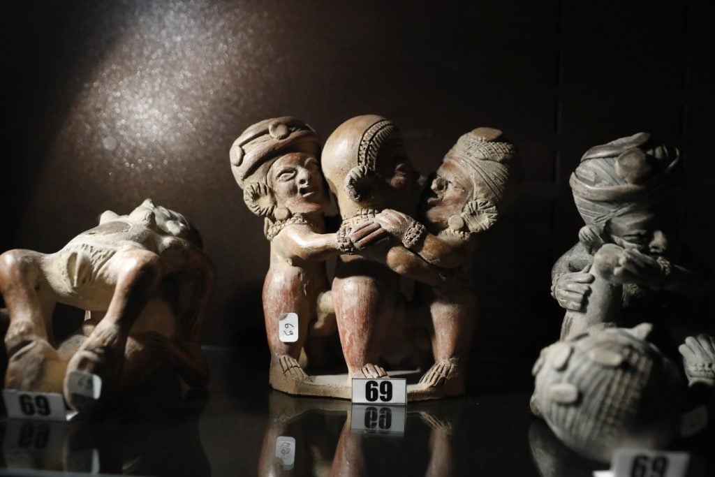 Pre-Colombien erotic sculptures are pictured at the Erotic Museum of Paris. Courtesy of PATRICK KOVARIK/AFP/Getty Images.