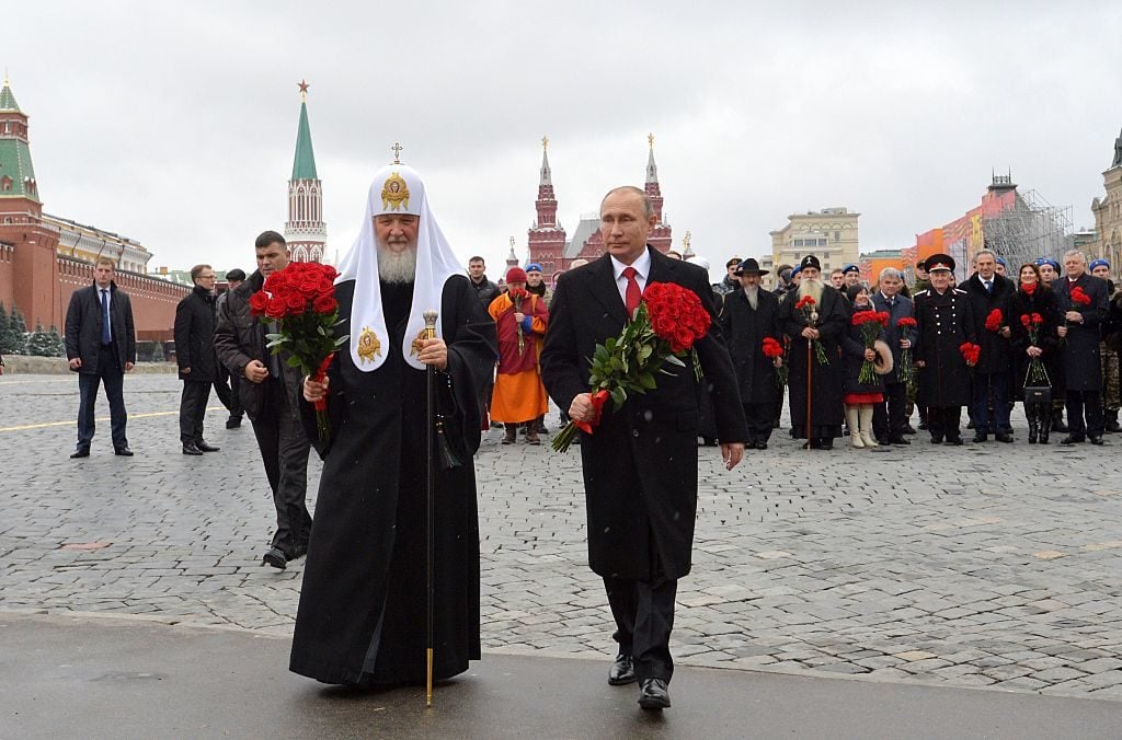 Russian President Vladimir Putin and Patriarch of Russia Kirill lay flowers to the monument to Dmitry Pozharsky and Kuzma Minin at the Red square near the Kremlin marking a National Unity Day in Moscow on November 4, 2016. Photo Alexei Druzhinin/AFP/Getty Images.
