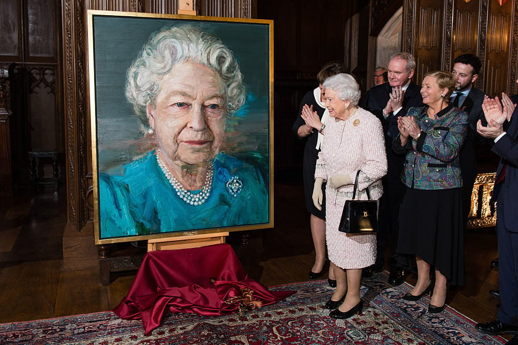 Queen Elizabeth II, unveils her portriat with Martin McGuinness, Deputy First Minister of Northern Ireland, and Frances Fitzgerald, Minister of Justice and Equality Gov of Ireland. Photo Jeff Spicer - WPA Pool/Getty Images