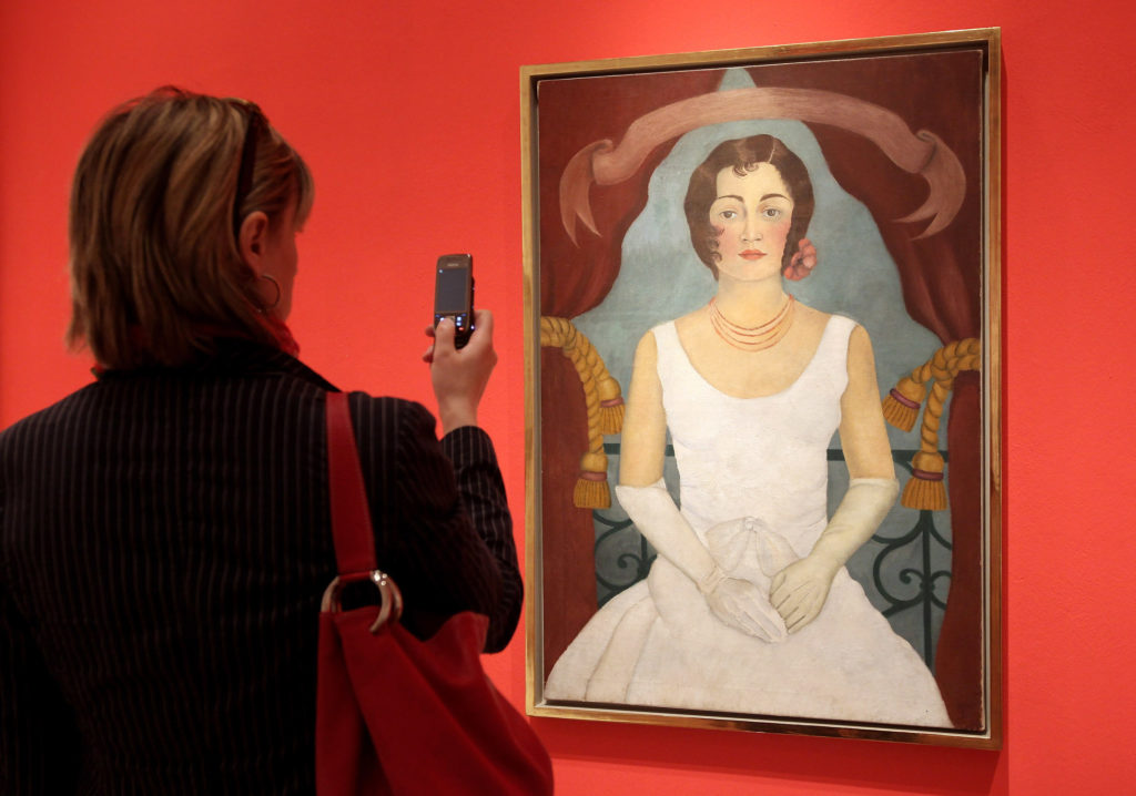 A visitor looks at "Portrait of a Lady in White" at the Frida Kahlo Retrospective at Martin-Gropius-Bau on April 29, 2010 in Berlin. Courtesy of Sean Gallup/Getty Images.