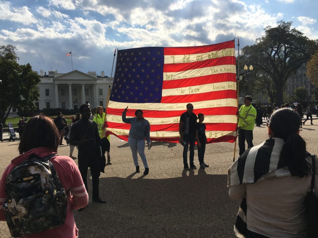 T.rutt's American flag embroidered with Trump's quote, on display outside the White House. Image courtesy T.rutt.