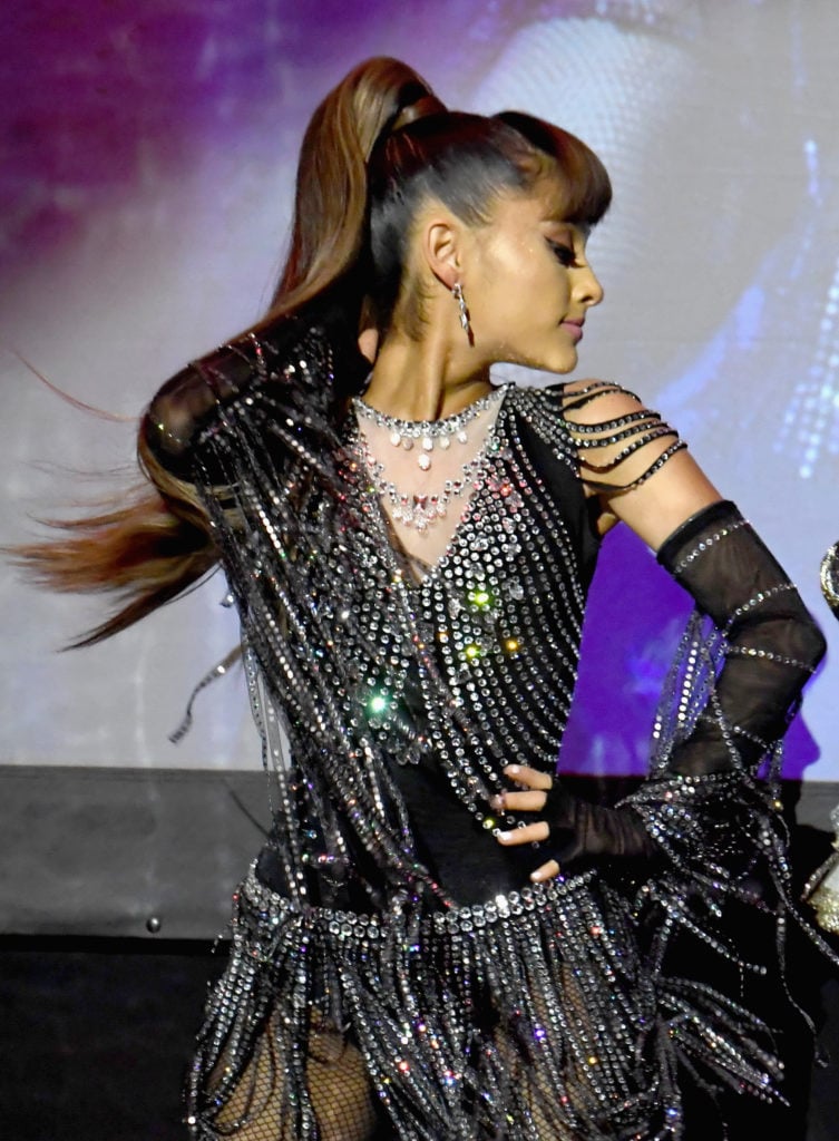 Ariana Grande on stage during Madonna's Evening of Music, Art, Mischief and Performance to Benefit Raising Malawi at Faena Forum on December 2, 2016 in Miami Beach, Florida. Courtesy of Jeff Kravitz/FilmMagic for Raising Malawi.