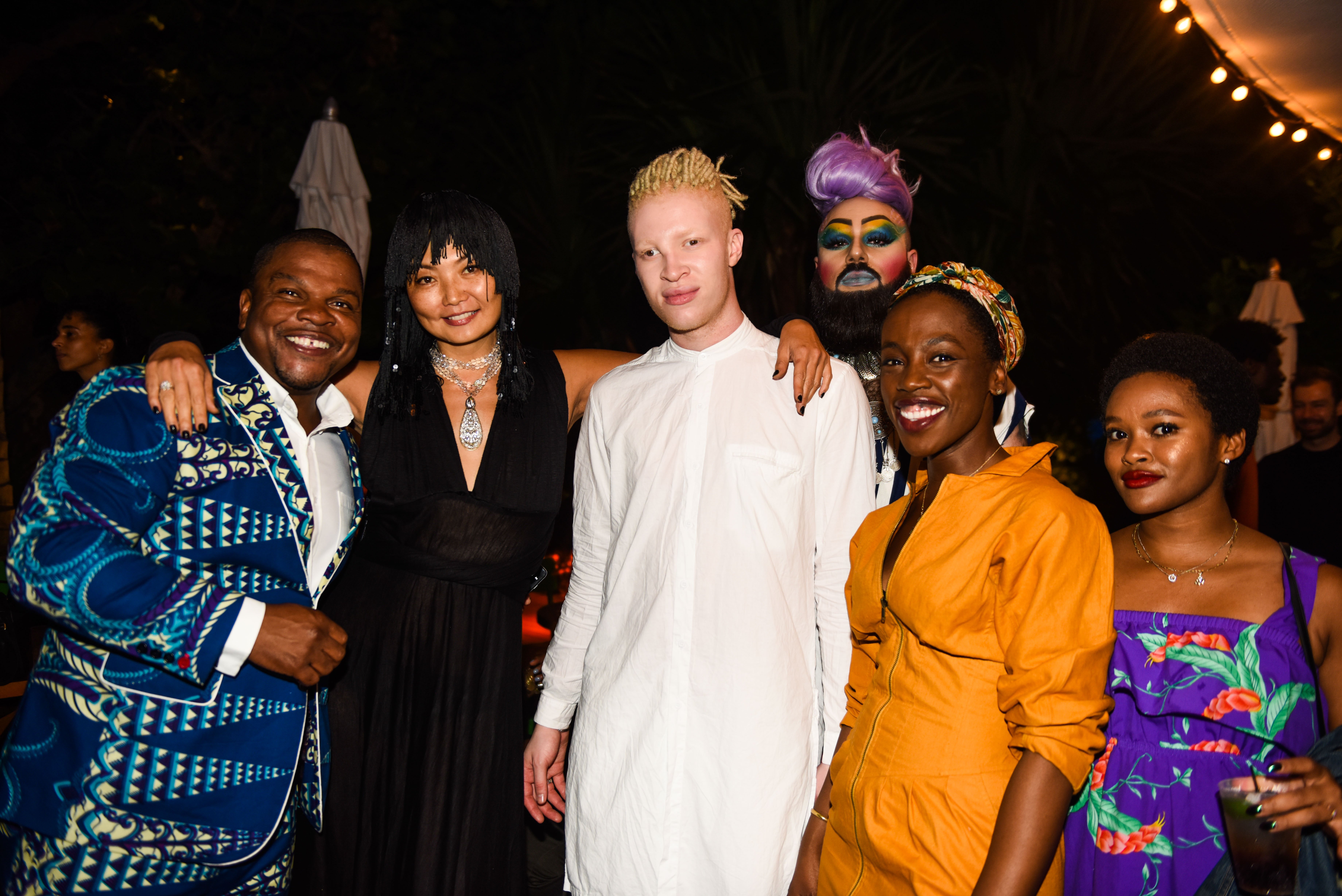 Kehinde Wiley, Irina Pataeva Shaun Ross, abd Dee T. Bear at Kehinde Wiley's Southern Fish Fry. Courtesy of BFA.