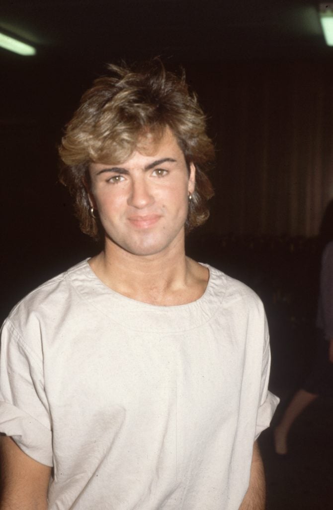 English pop star and one half of the duo 'Wham', George Michael in 1984. Courtesy of Hulton Archive/Getty Images.