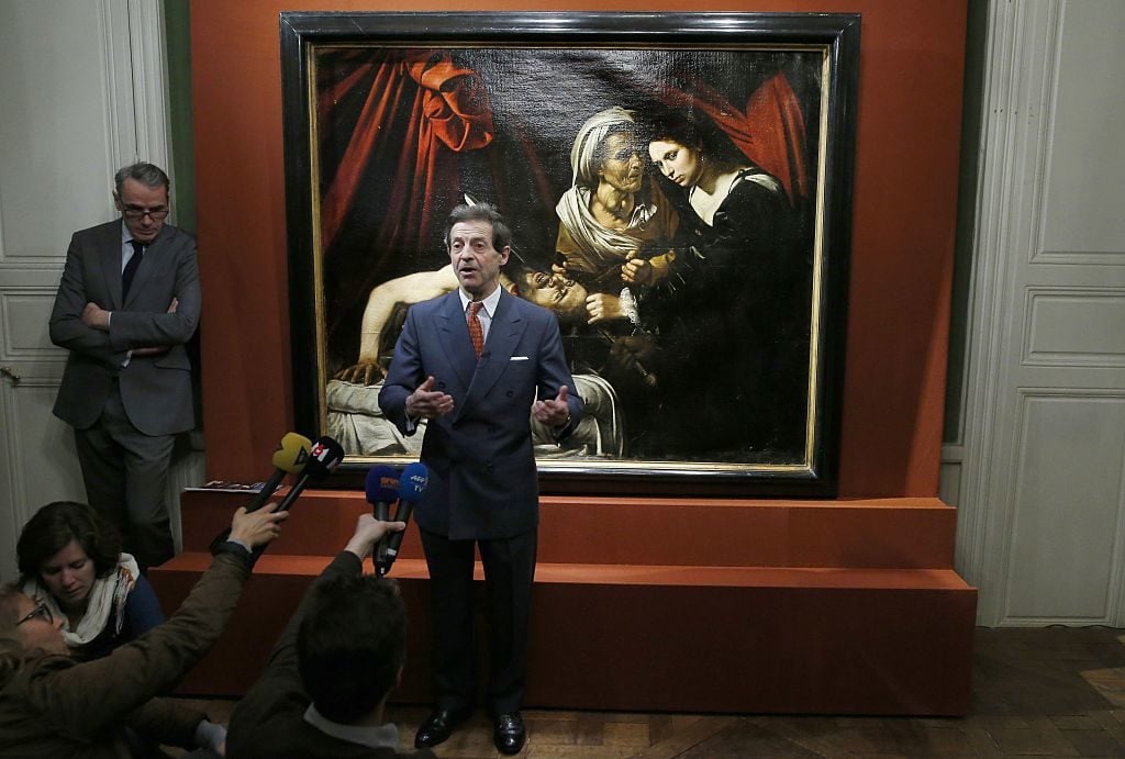 French painting expert Eric Turquin announcing the authentication of Michelangelo Merisi da Caravaggio <i>Judith Beheading Holofernes</i>. Photo courtesy Patrick Kovarik/AFP/Getty Images.