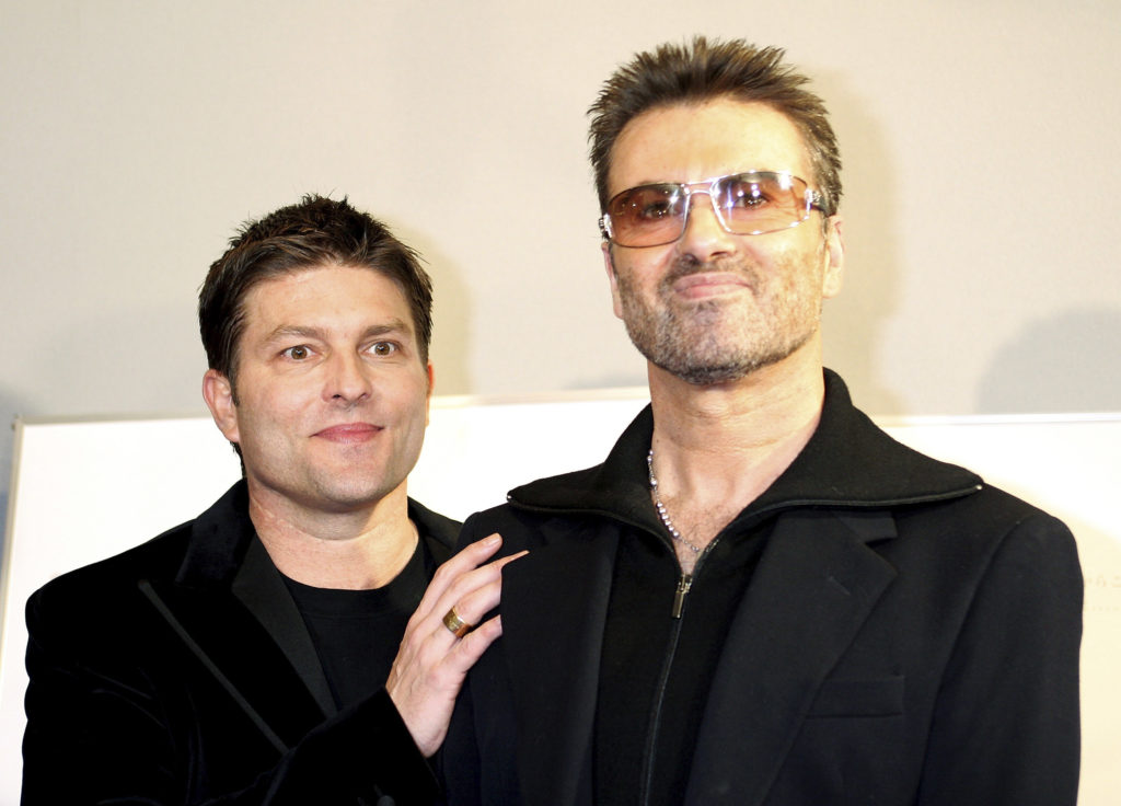 British pop star George Michael and his partner Kenny Goss. Courtesy of Junko Kimura/Getty Images.