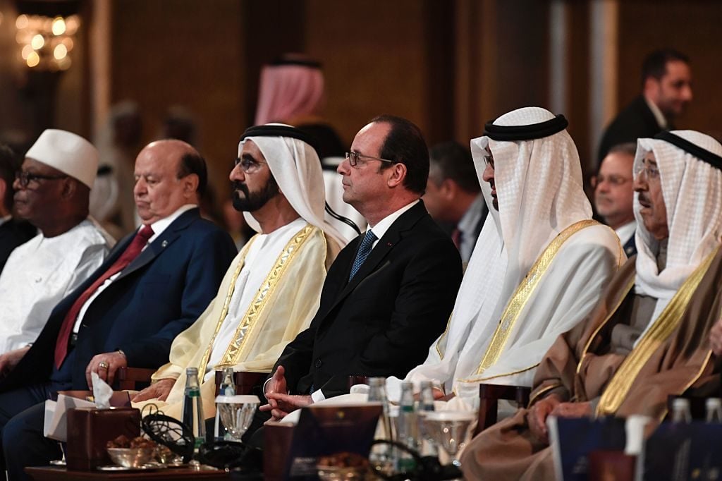 In the center, UAE Prime Minister Sheikh Mohammed bin Rashid al-Maktoum sits next to French President Francois Hollande at the international conference on protecting the world's cultural heritage. Photo courtesy Stephane De Sakutin/AFP/Getty Images.