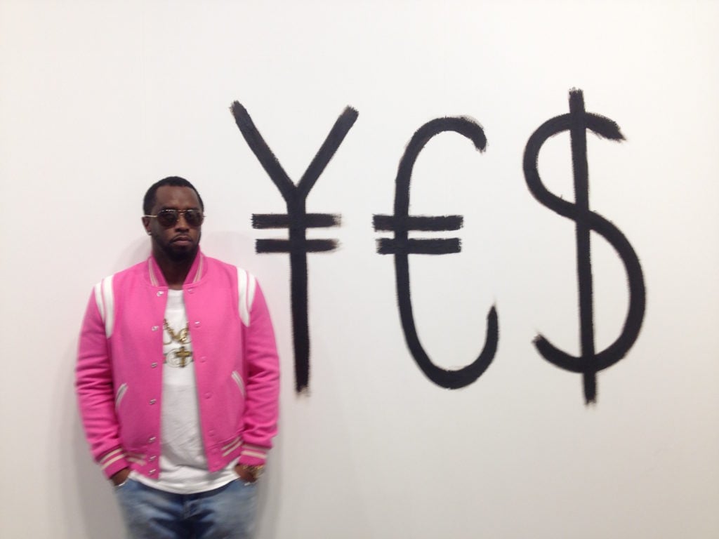 Sean "Diddy" Combs with <em>¥€$</em> by Julieta Aranda at Mexico City's Galería OMR gallery booth at Art Basel in Miami Beach. Courtesy of Sarah Cascone.