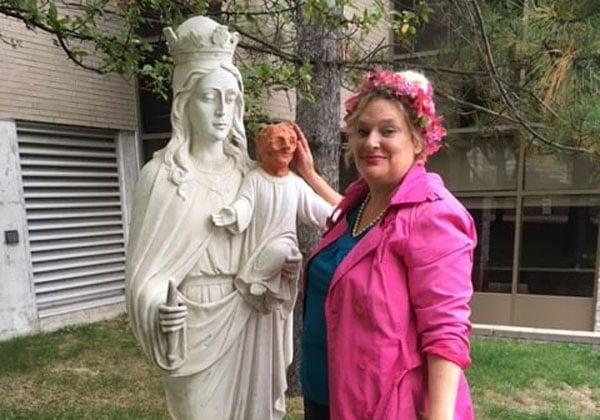 Heather Wise with her infamous terracotta baby Jesus head. Courtesy of Father Gérard Lajeunesse. 
