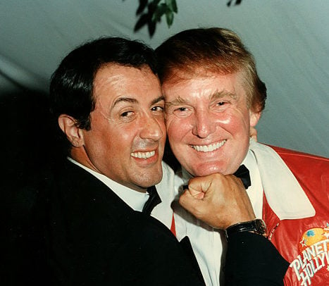 Portrait of American actor Sylvester Stallone as he mimes punching businessman Donald Trump on the chin at a charity event (for lupus) held at Bud and Marla Paxon's home, Palm Beach, Florida, February 24, 1997. Photo by Davidoff Studios/Getty Images.